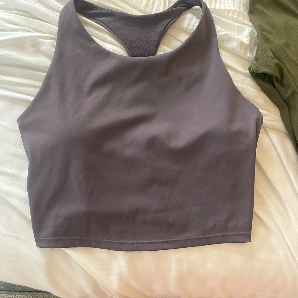 Cropped purple/grey razorback workout top.